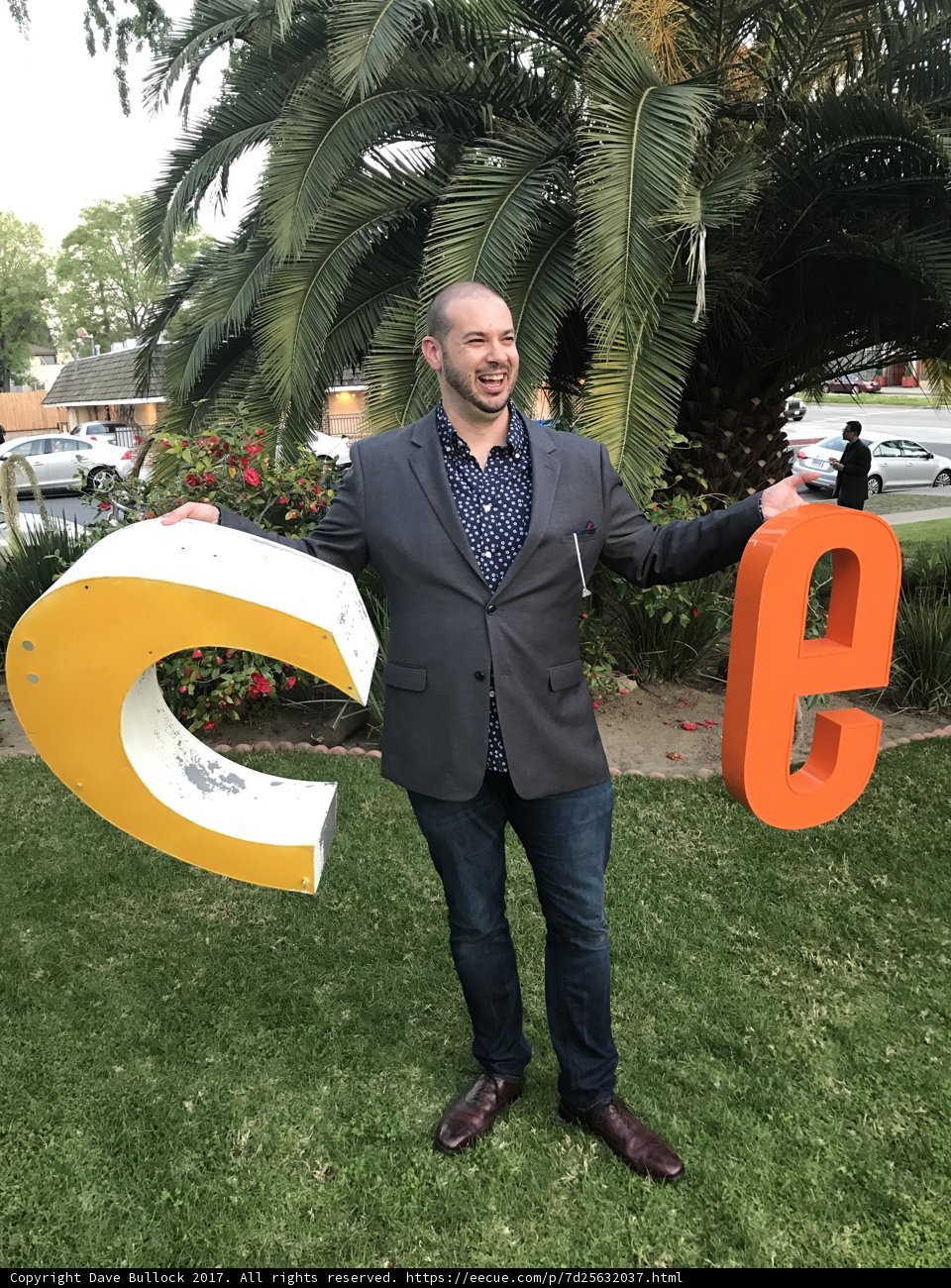 Man Standing in Front of "C" Sign in LA