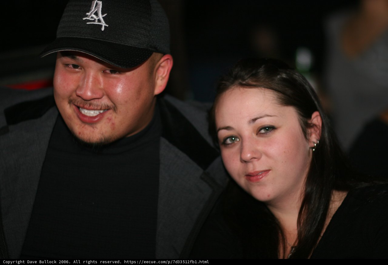 Smiling Partygoers in Baseball Caps