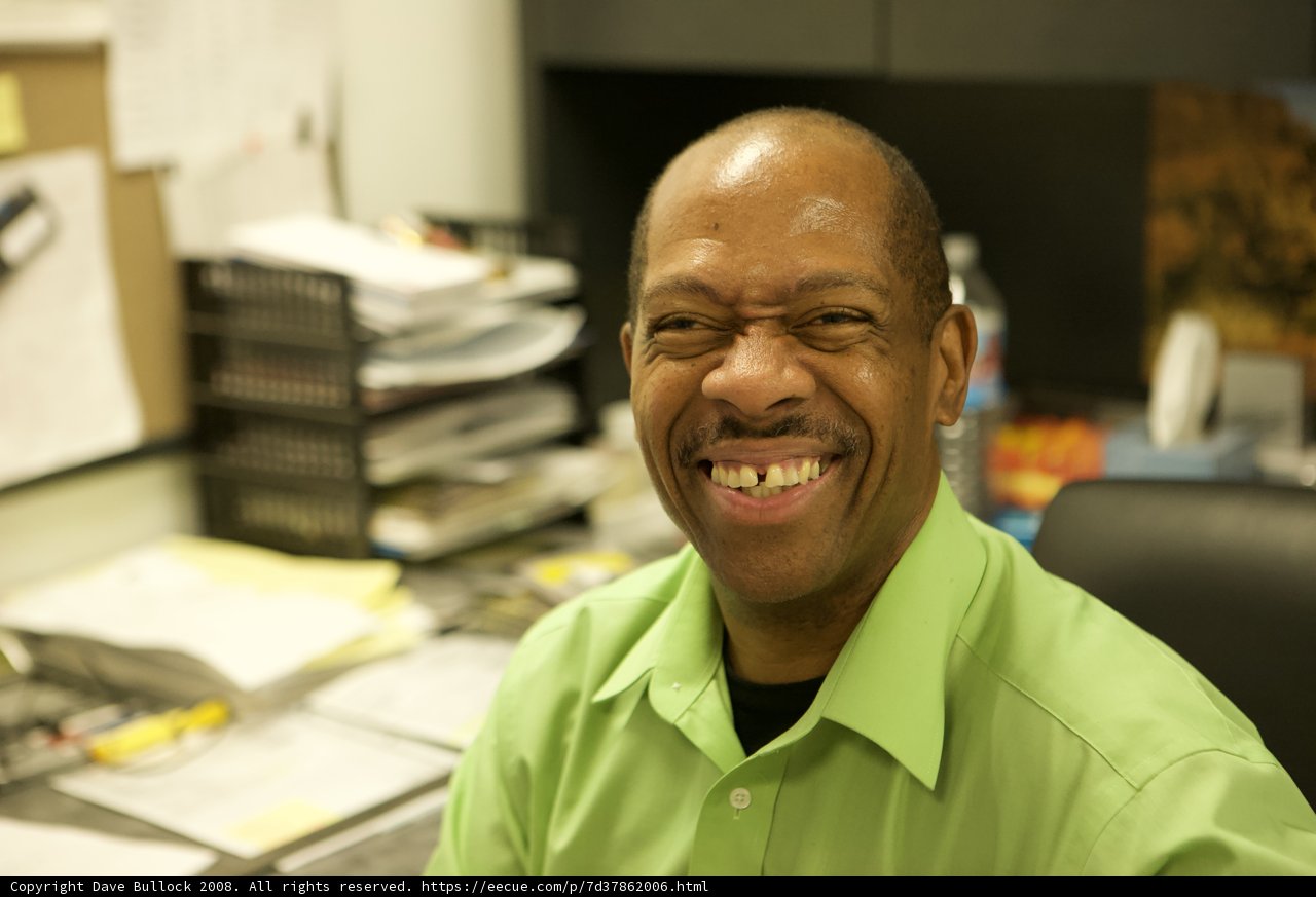 Smiling Executive in Green Shirt