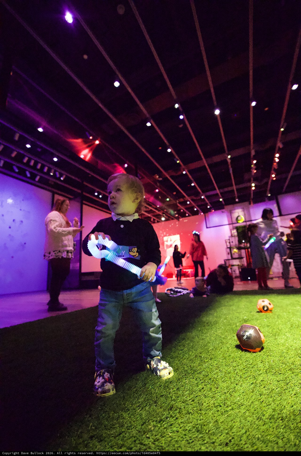 Child Plays with Light Toy at Asian Art Museum Baby Rave