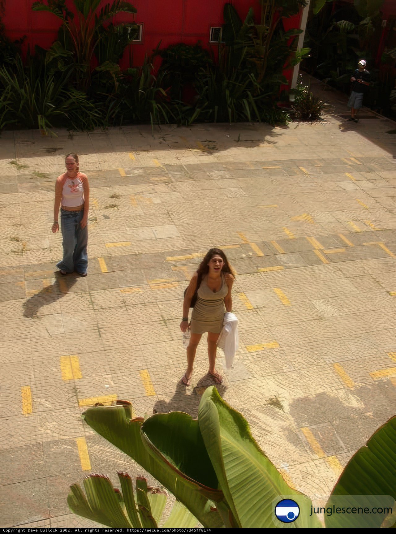 Two Women Strolling by the Red Building