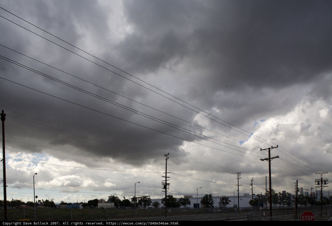 Electric Wires Intersect the Cloudy Sky
