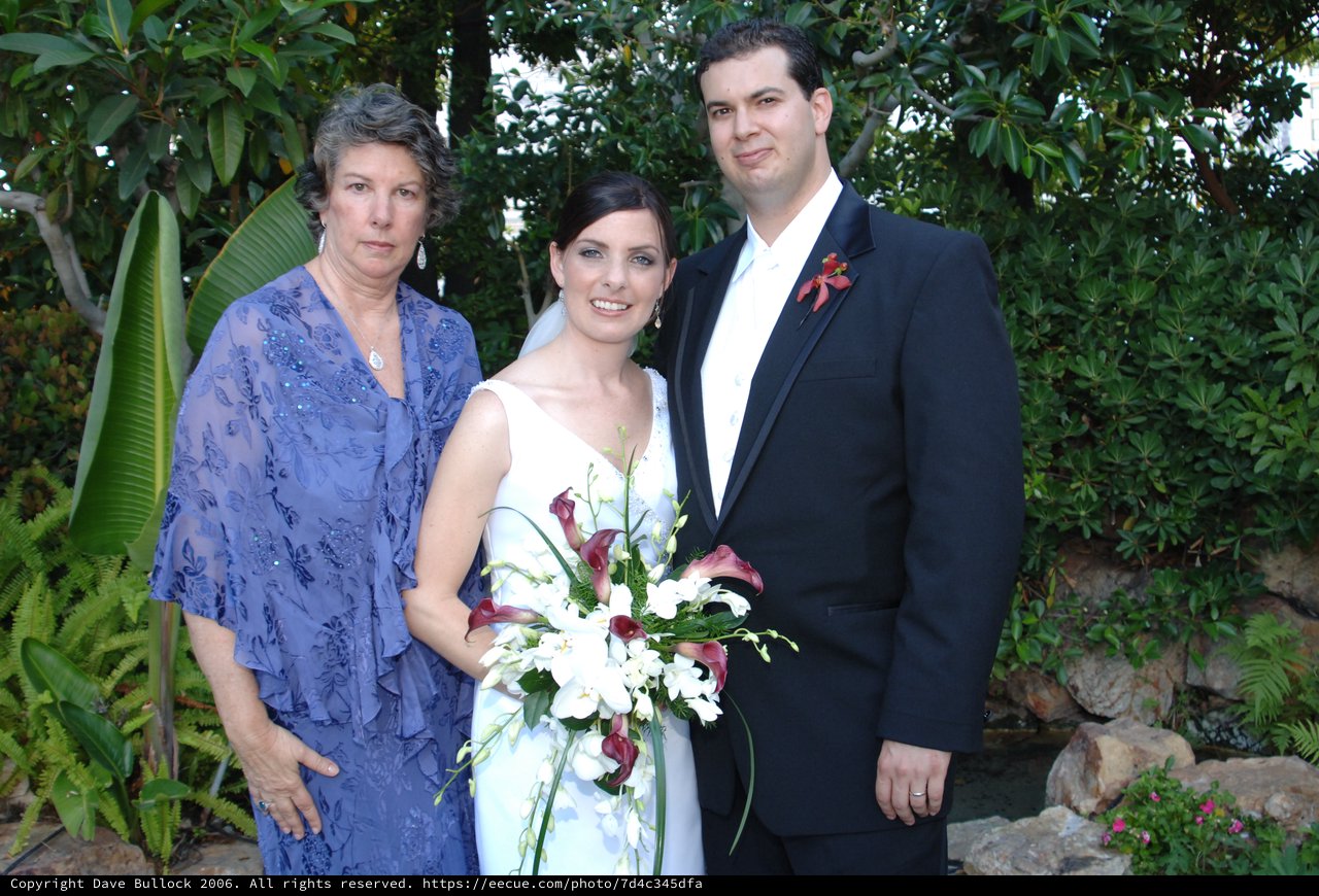 Wedding Portrait with Mother and Newlyweds in Garden