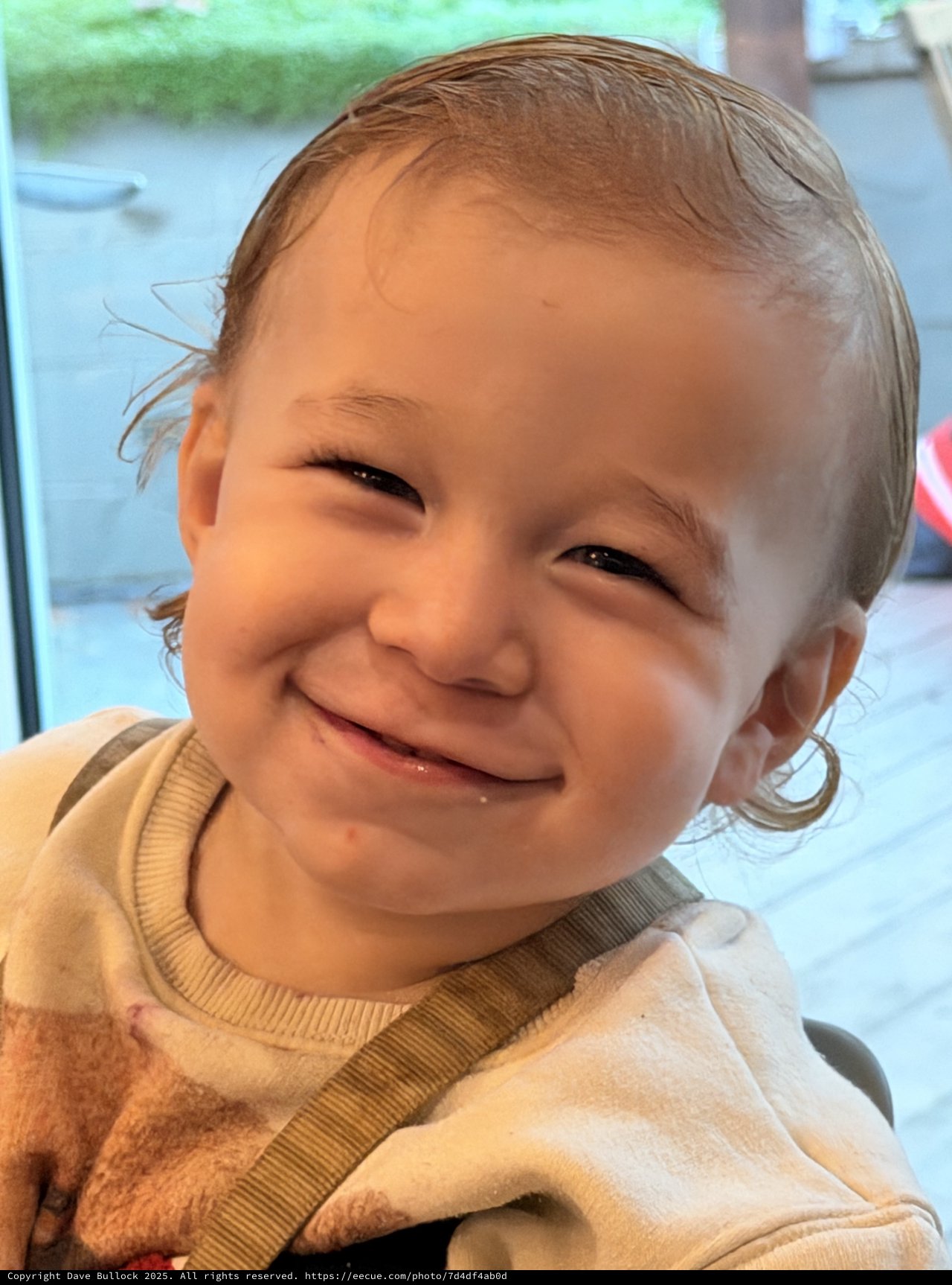 Joyful Toddler Portrait with Beaming Smile