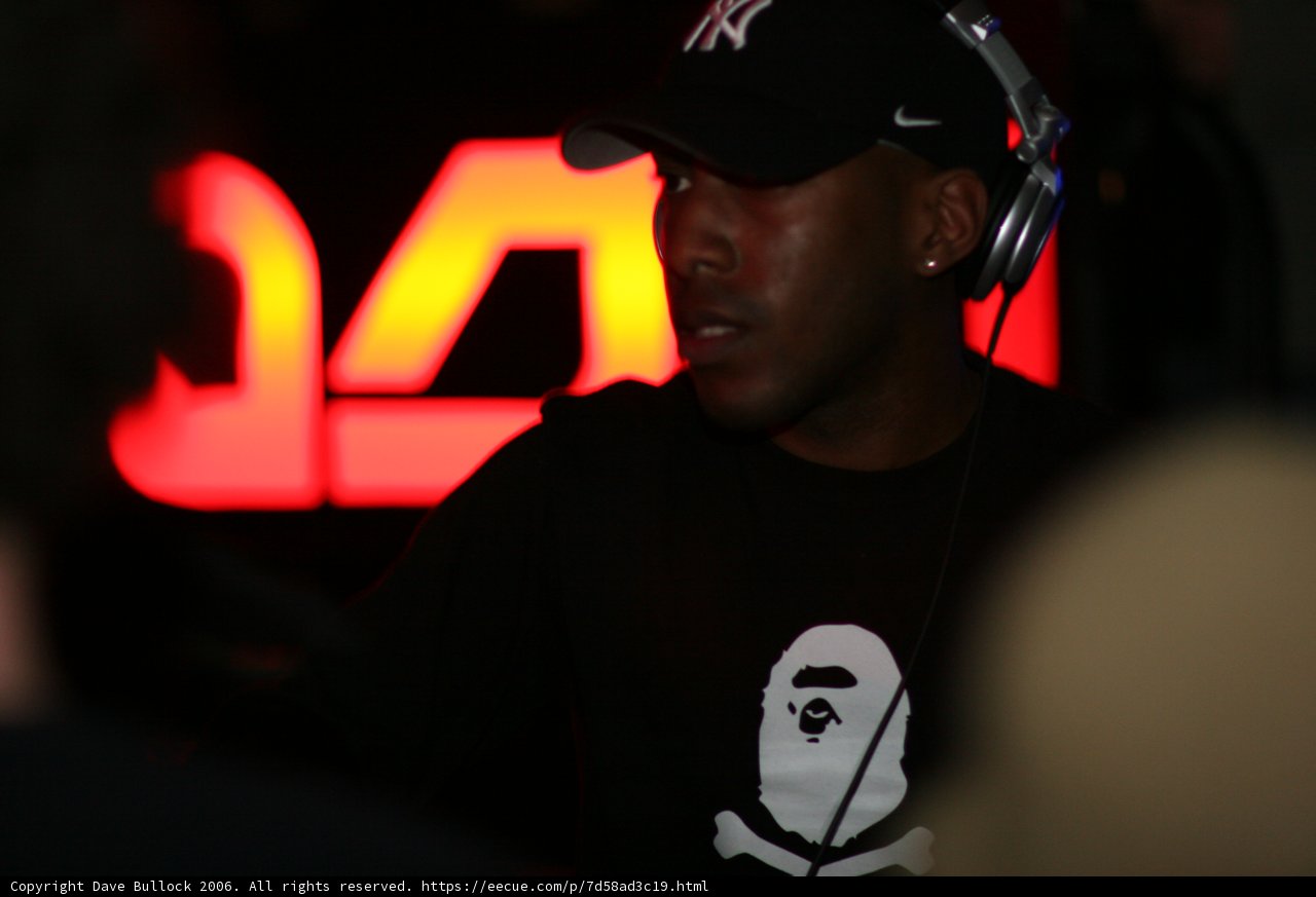 Black Shirted Man in Baseball Cap