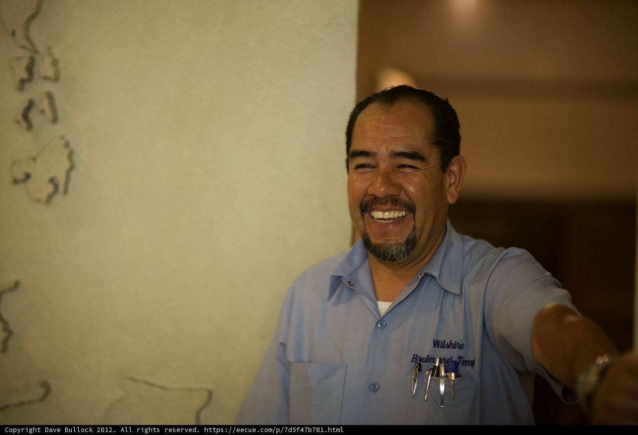 Smiling Man in Blue Shirt
