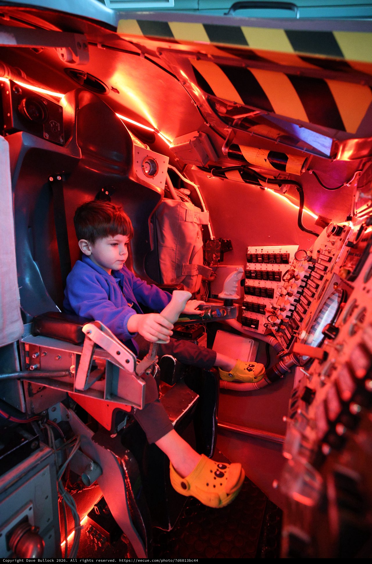 Young Visitor Explores Submarine Periscope Station