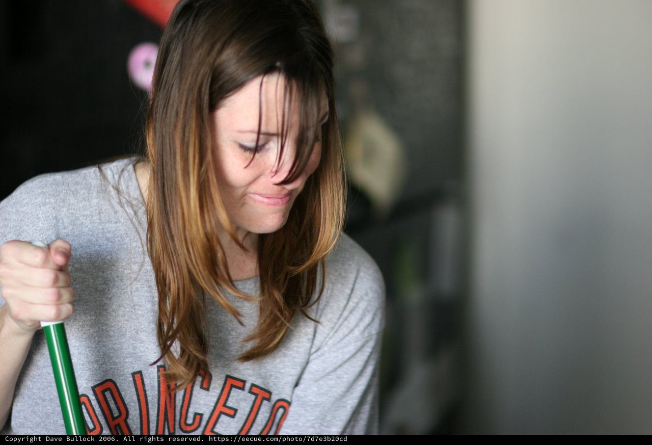 Young Woman Sweeping with Princeton Sweatshirt