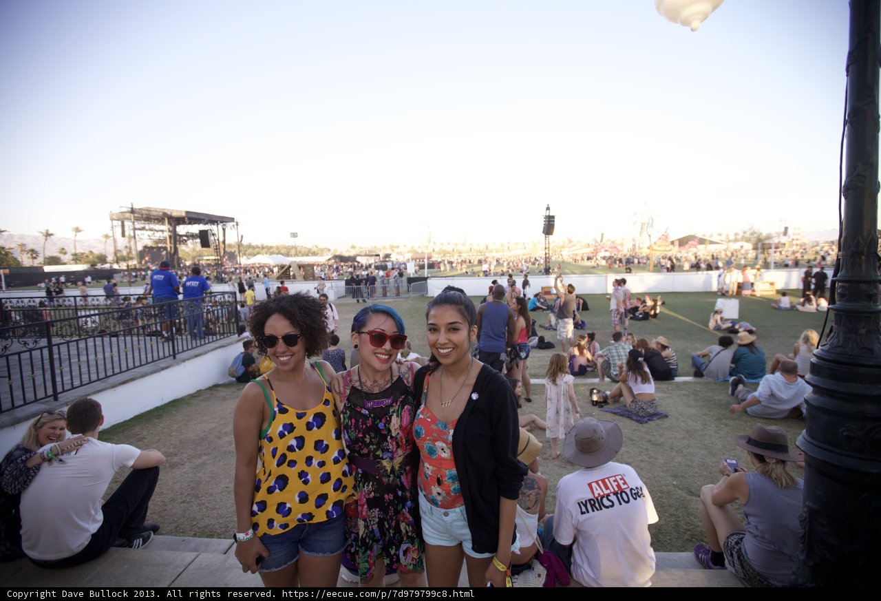Three Women Grooving to the Music Outdoors
