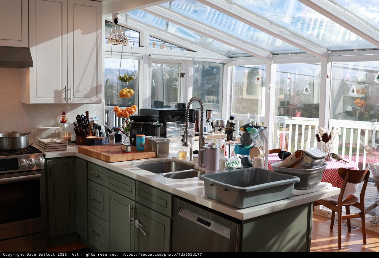 Busy Christmas Kitchen with Sun-Filled Greenhouse View