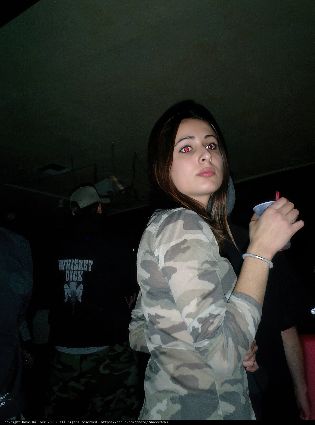 Camouflaged Woman in a Crowd