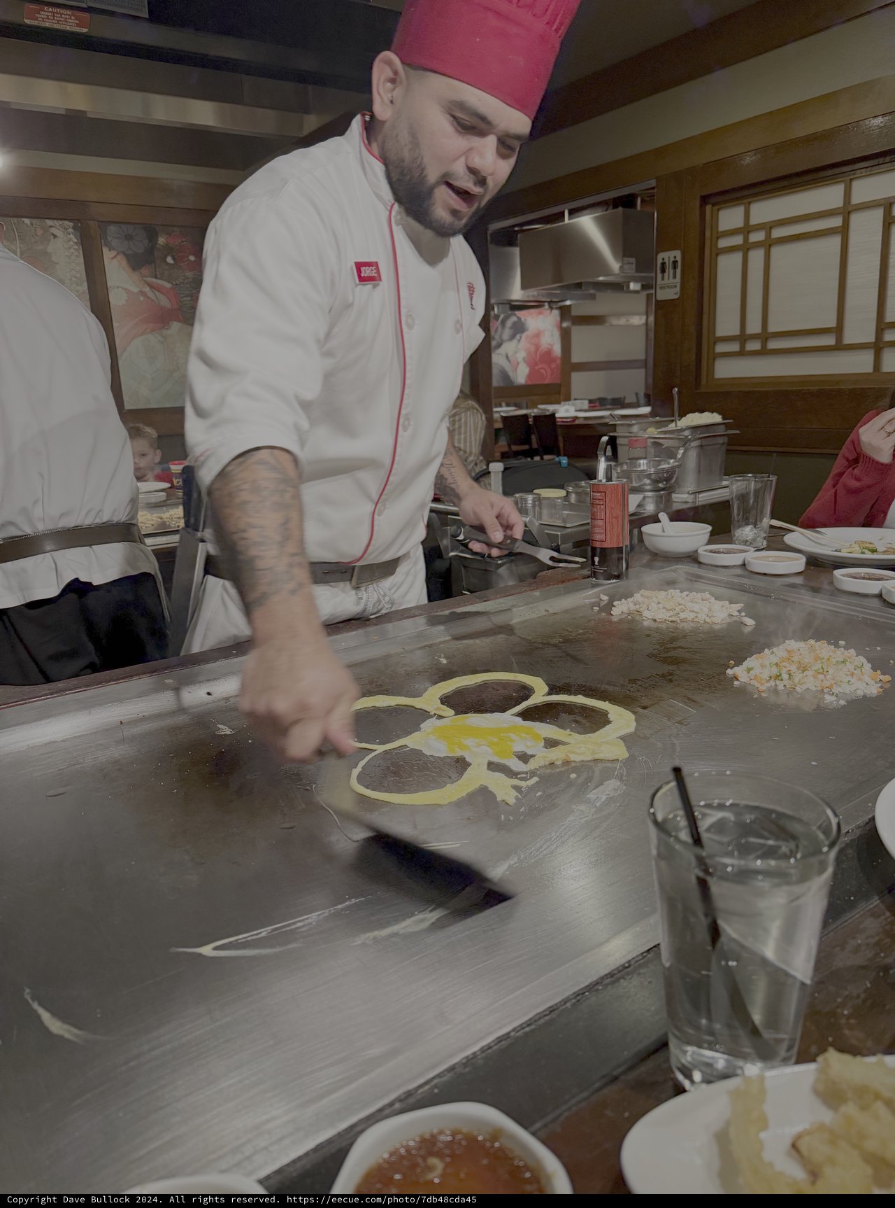 Japanese Chef Preparing Eggs on Teppanyaki Grill