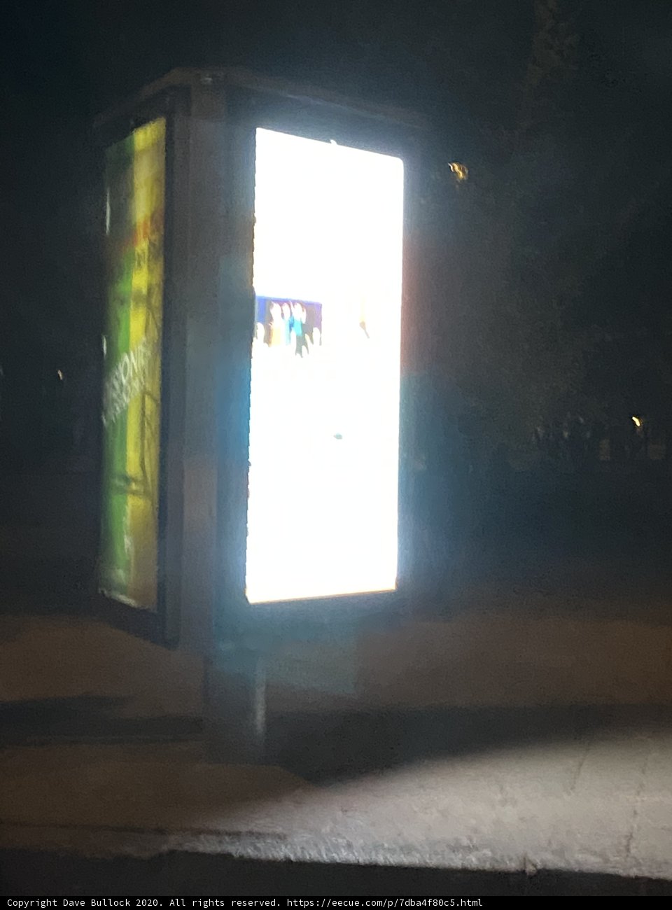 Nighttime Bus Stop Sign