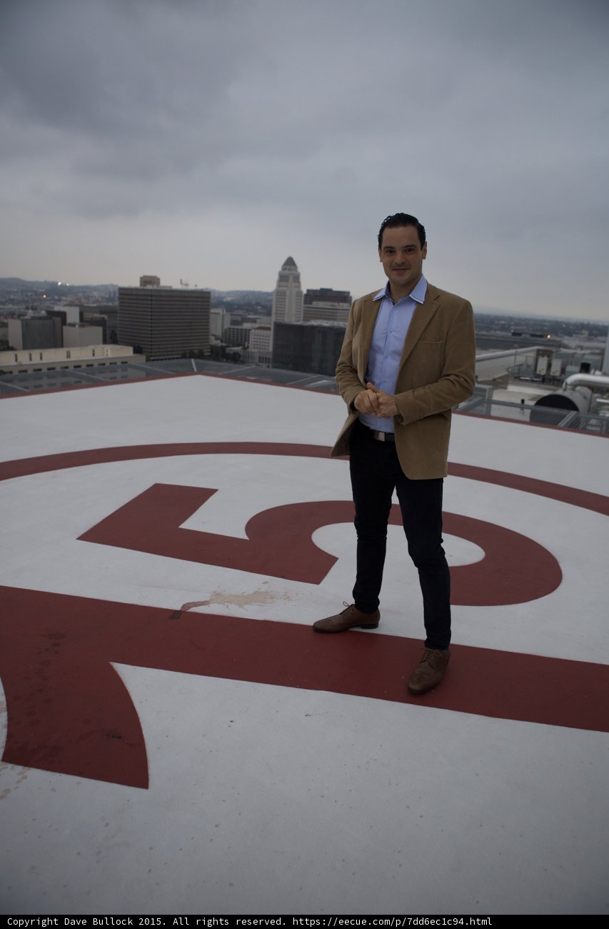 The Man on Top of the Red and White Building