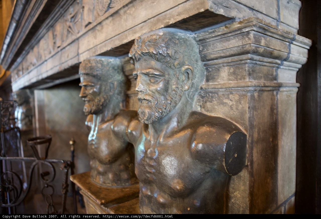 Bronze Men Adorn the Cryptic Wall