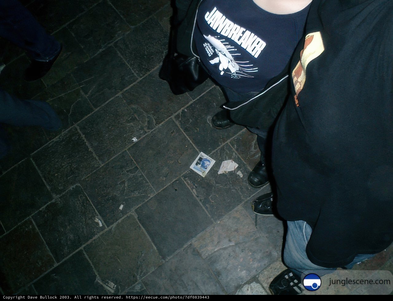 Sneakers and Handbags on Tile Floor