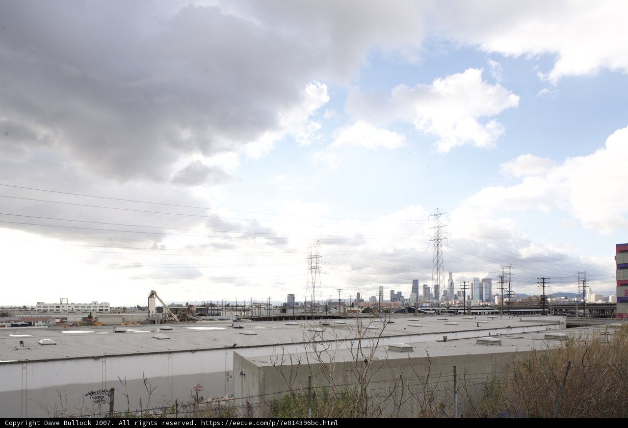 Cloudy Sky Over Industrial Waterfront