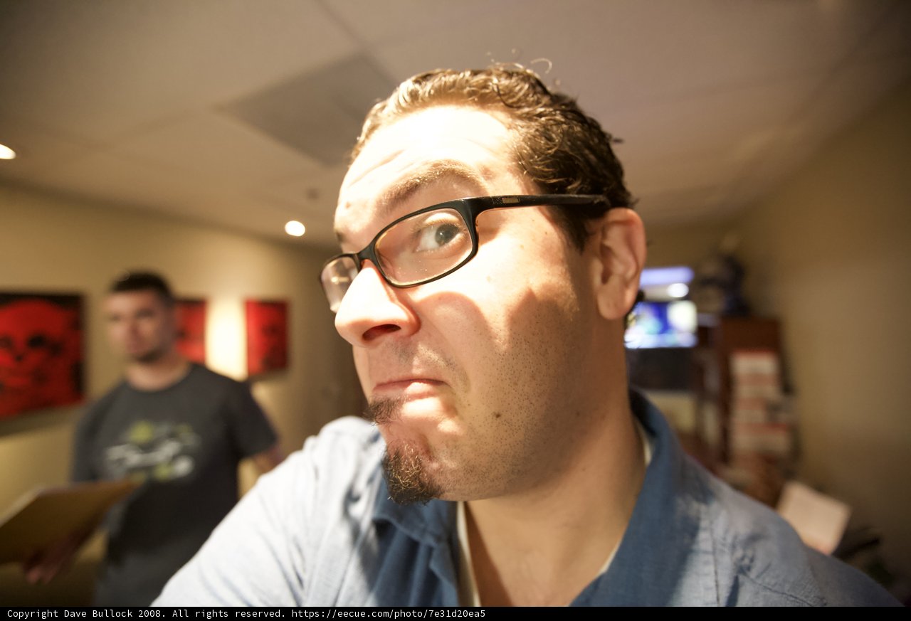 A Smiling Man with Glasses