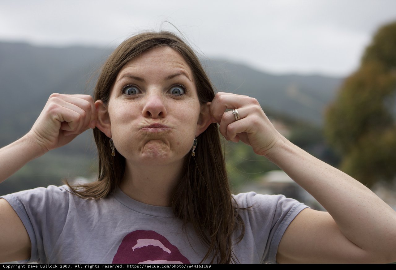 Playful Woman Making Silly Face Outdoors