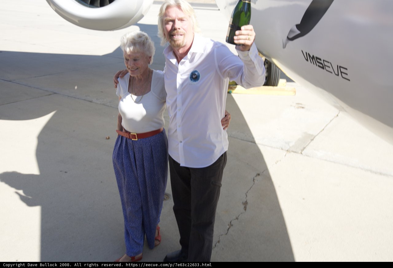 Richard Branson and his Lady Beside the Mighty Aircraft