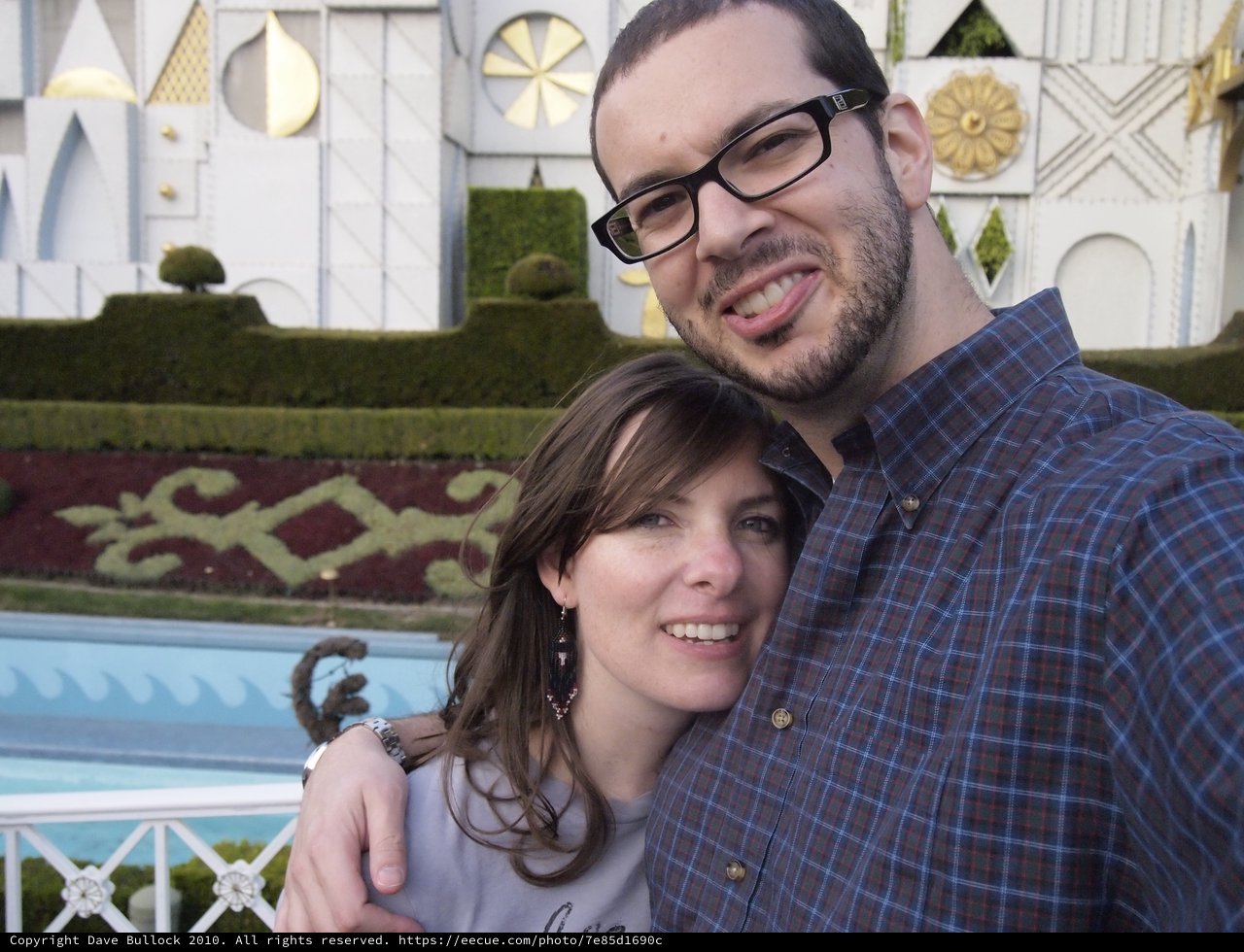 Couple Smiling Together at Disneyland's It's a Small World