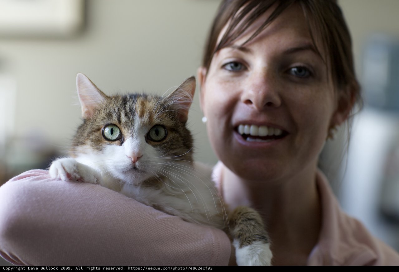 Woman and Tabby Cat Share a Joyful Moment