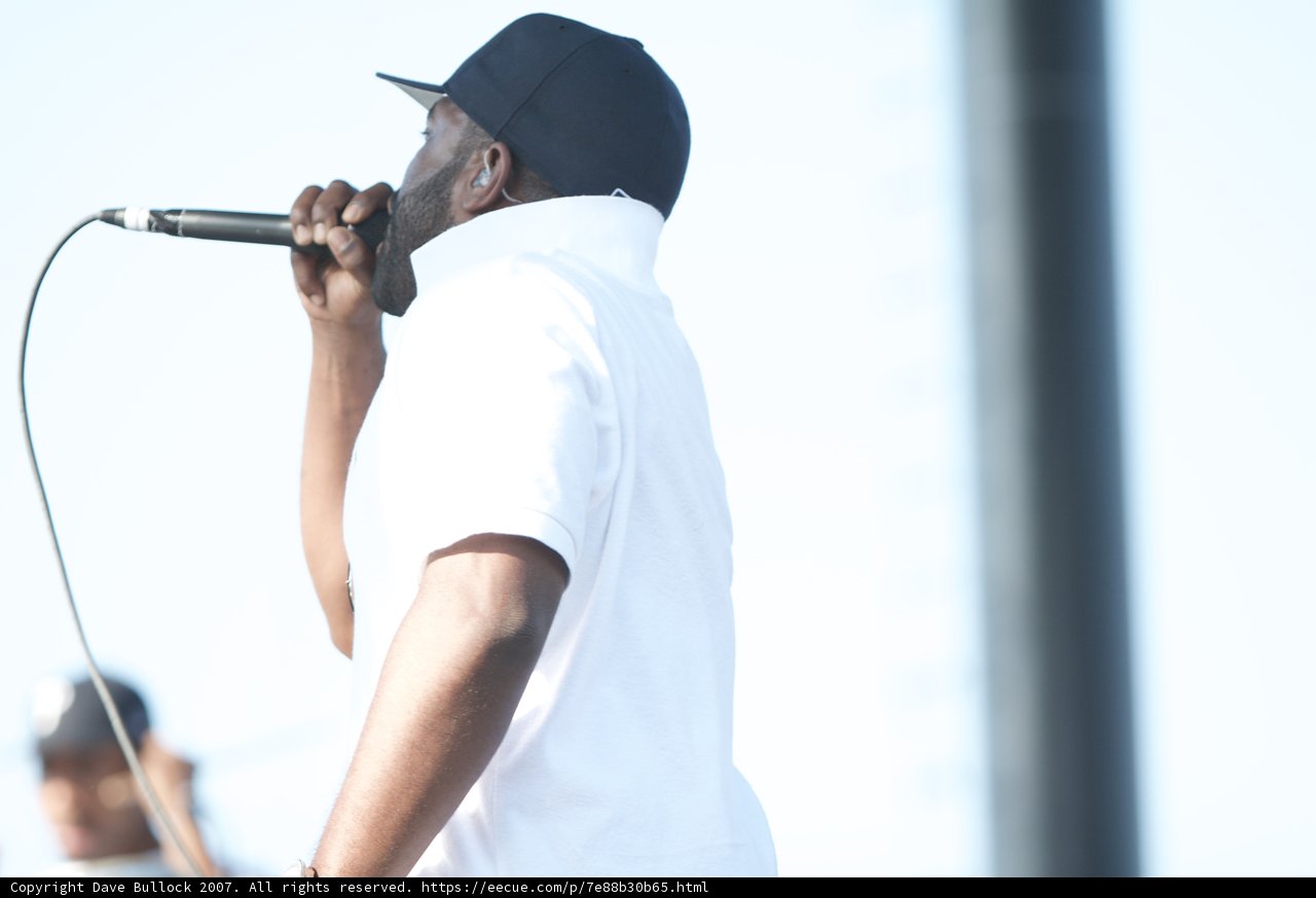 On Stage with a Mic and a Hat