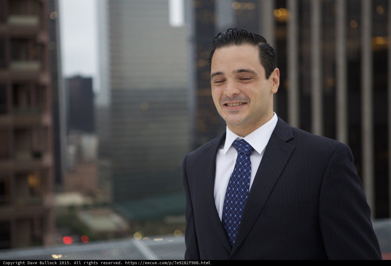 Man in Suit and Tie against Los Angeles Skyline