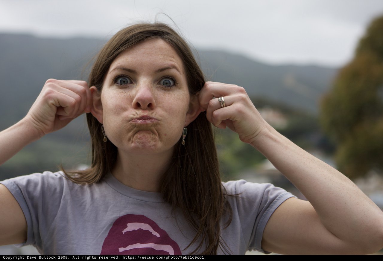 Playful Woman Making Funny Face Outdoors