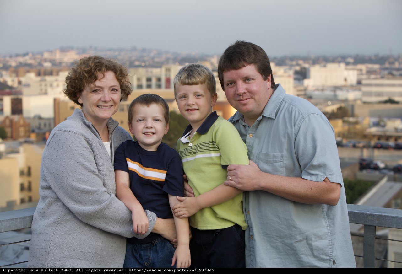 Family Portrait at Sunset on City Rooftop