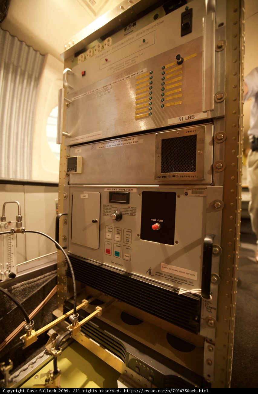 Man Operating Large Machine in Laboratory