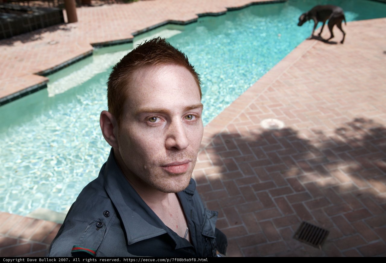 Man and Dog by the Pool