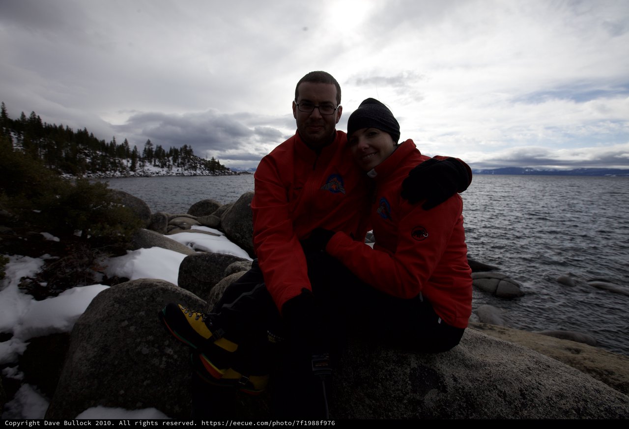 Couple Embracing at Snowy Lake Tahoe Shore