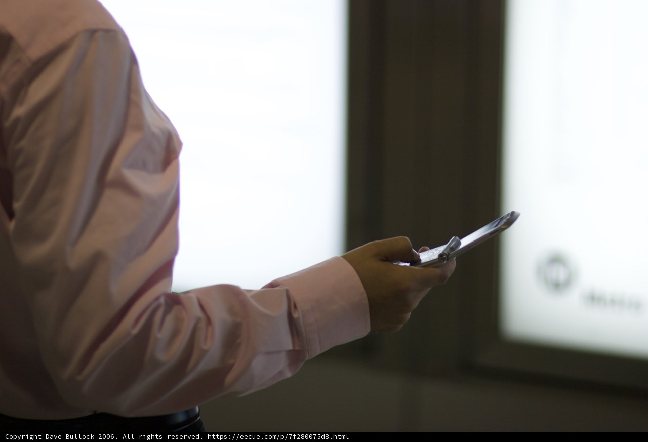 Tech-Savvy Man with a Dress Shirt and Mobile Phone