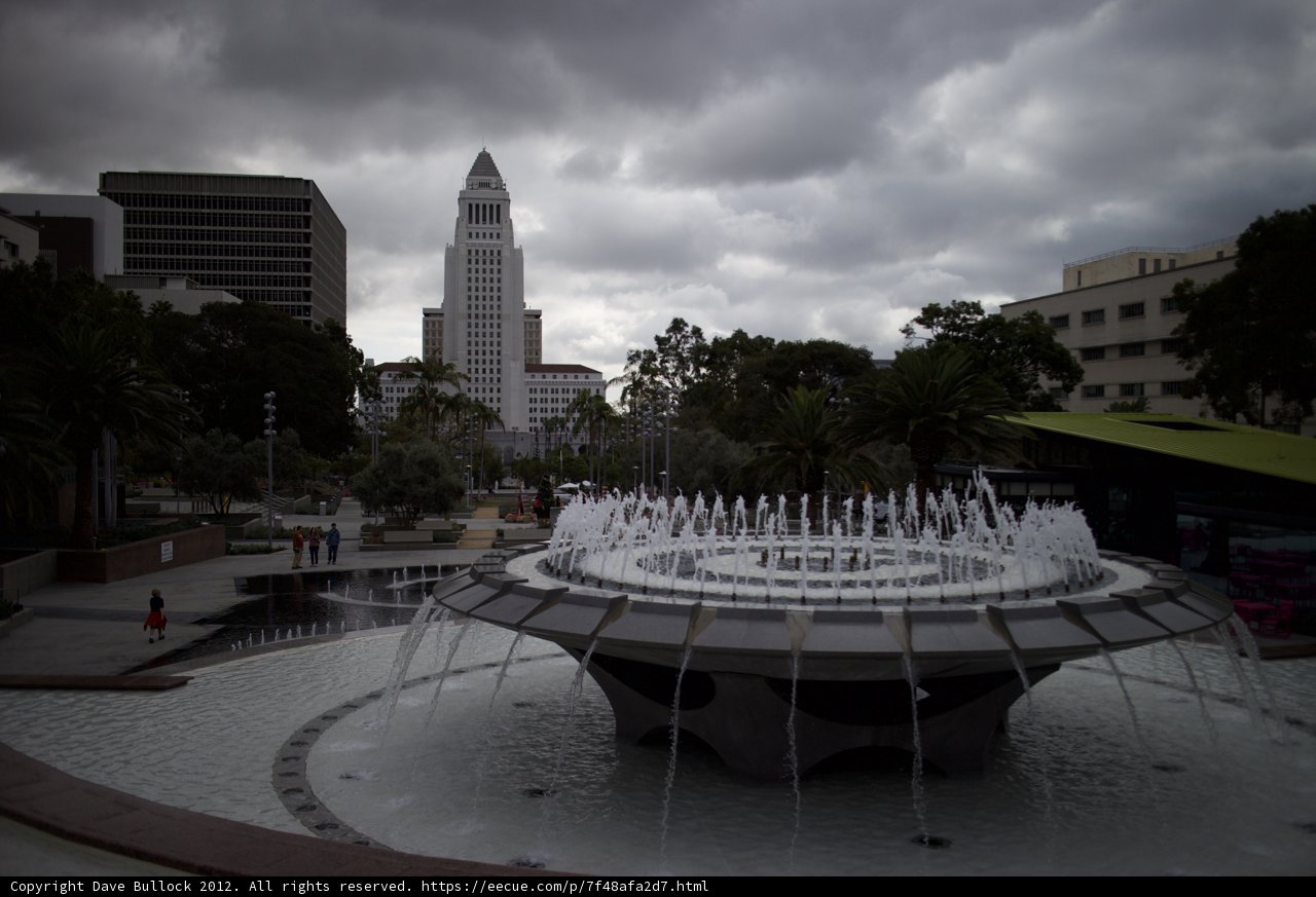 City Fountain in a Cloudy Metropolis