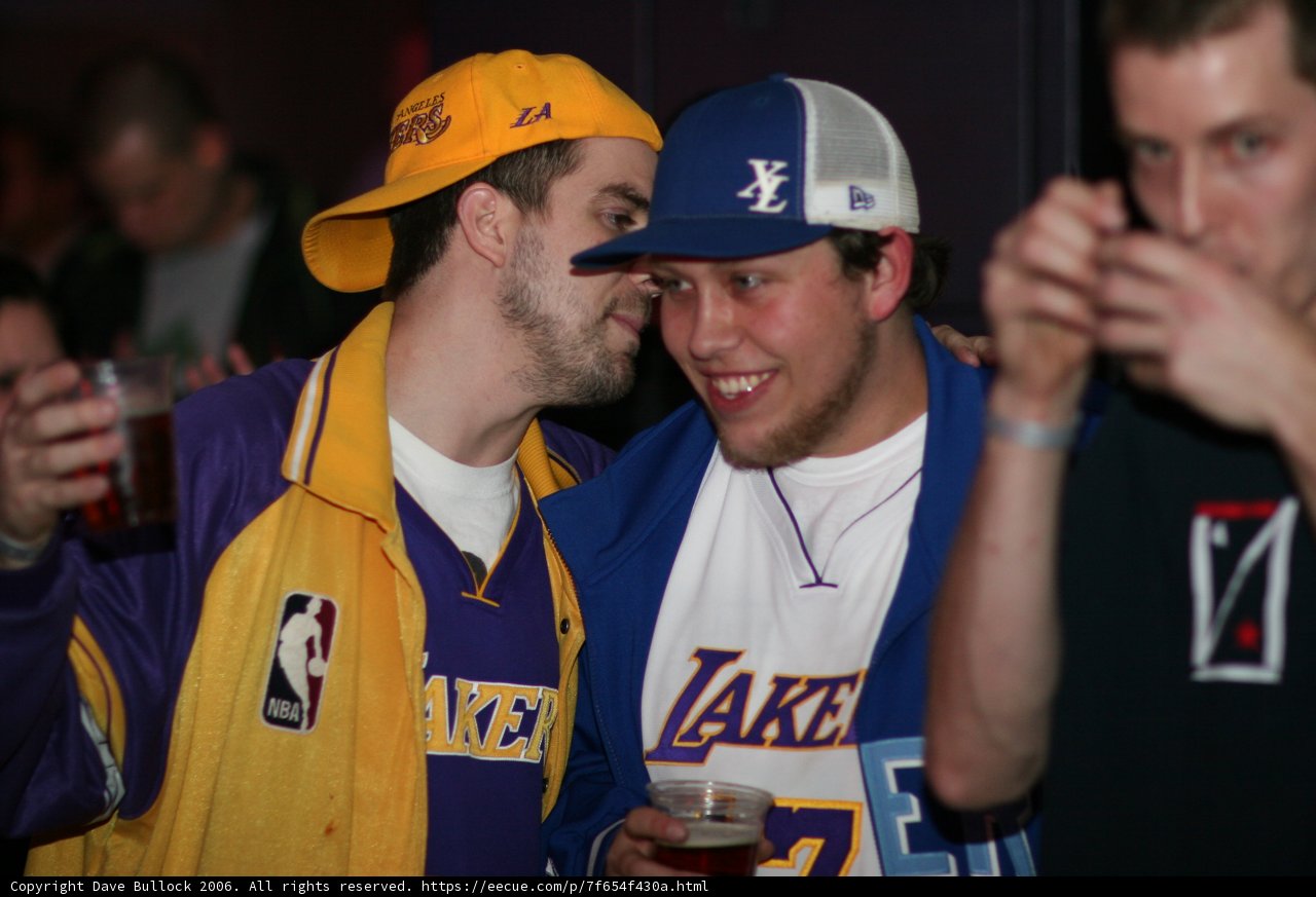 Lakers fans celebrate with a beer huddle