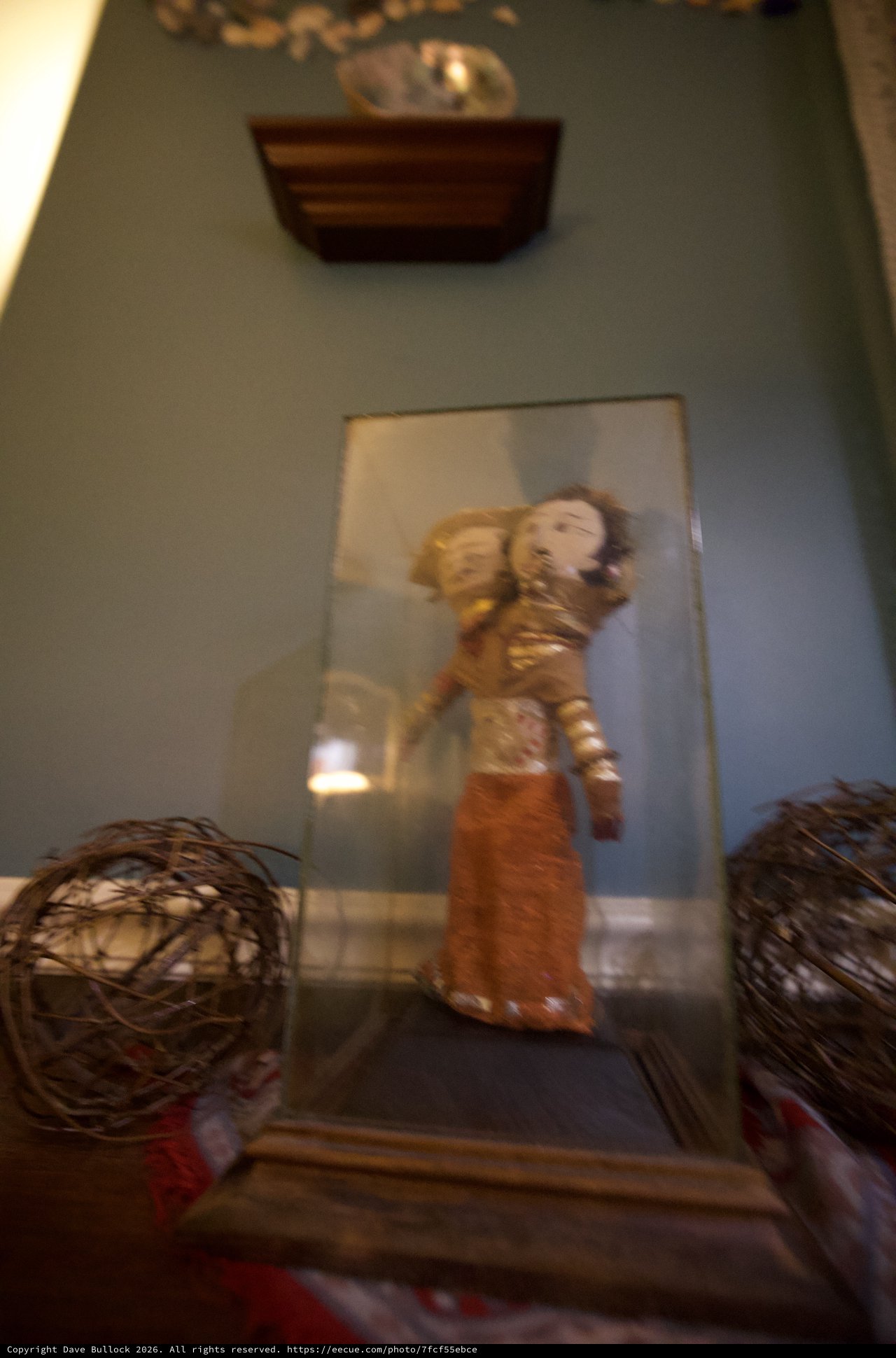 Asian Figurine Display with Decorative Spheres