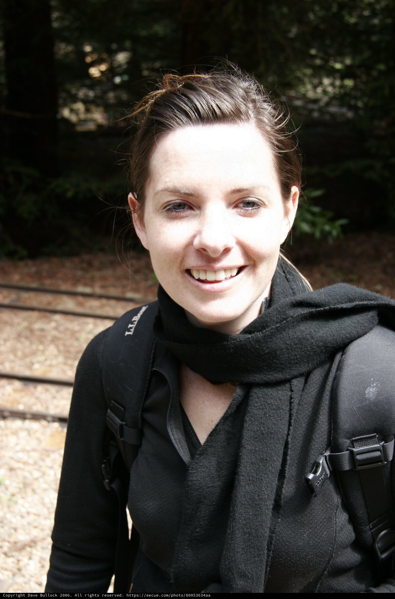 Smiling Hiker Outdoors in Forest Setting