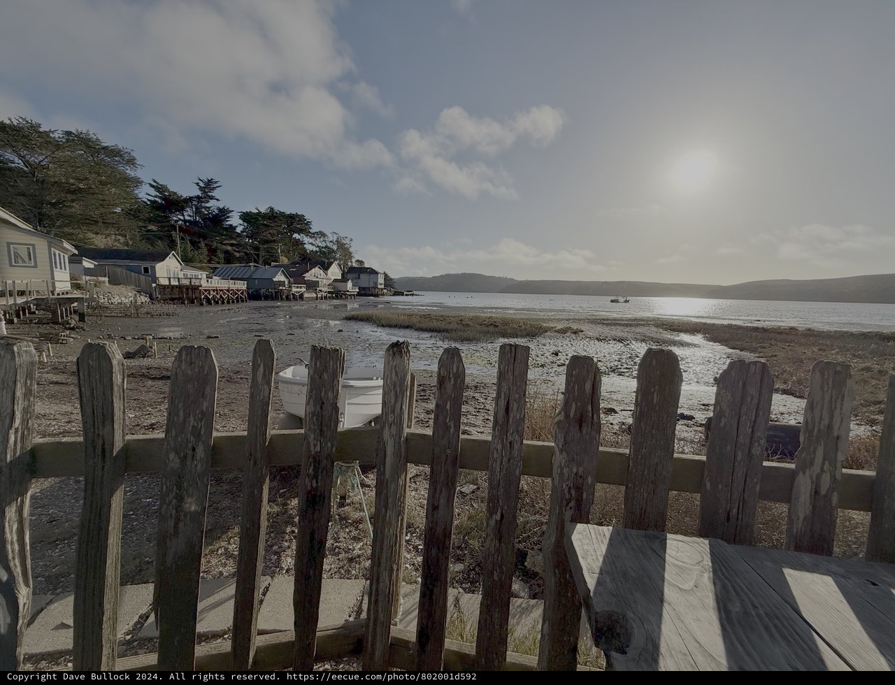 Weathered Wooden Fence Overlooking Coastal Bay