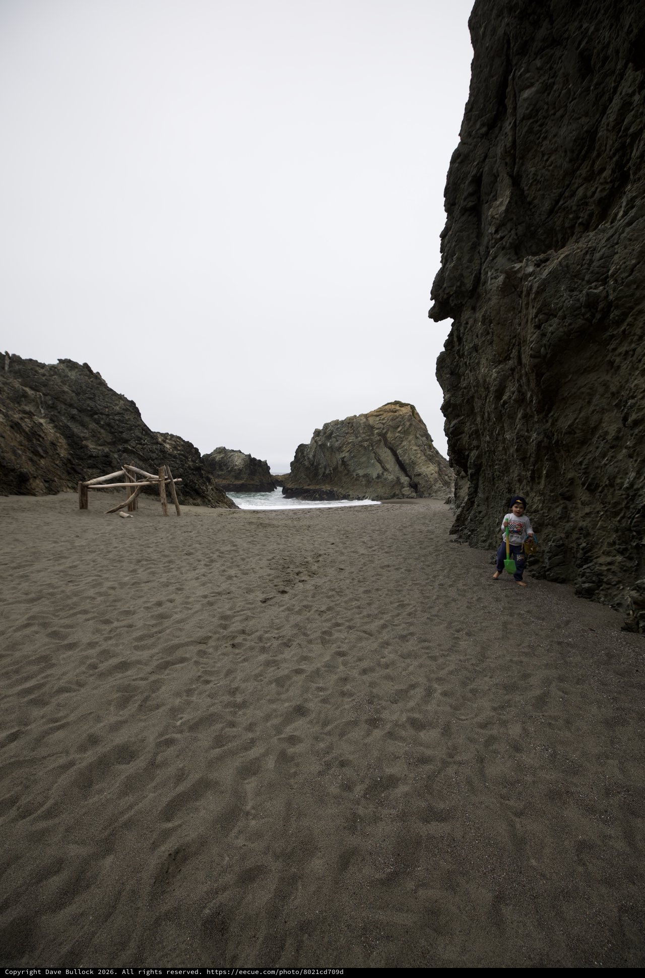 Child Explorer in a Secluded Rocky Cove Beach