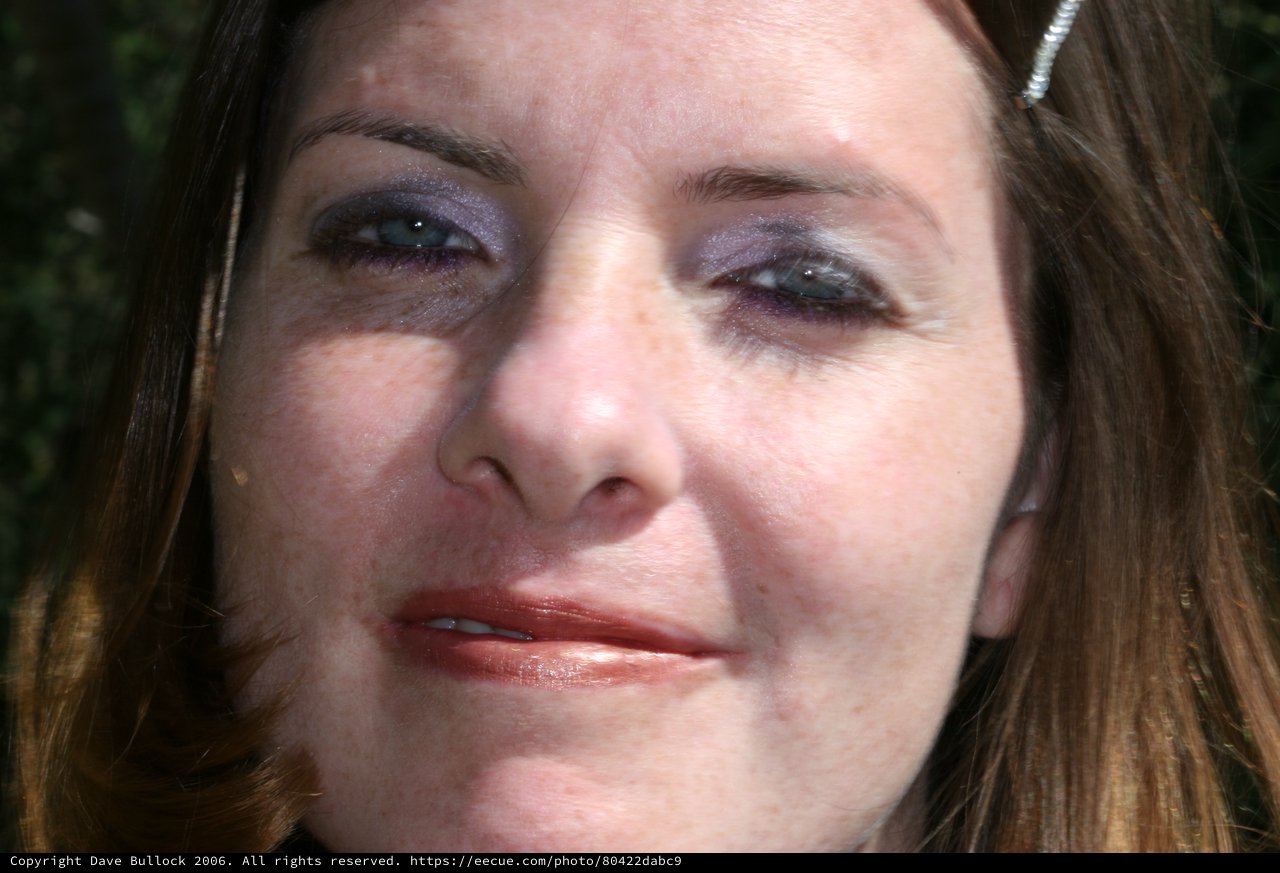 Close-Up Portrait of Woman in Sunlight Outdoors