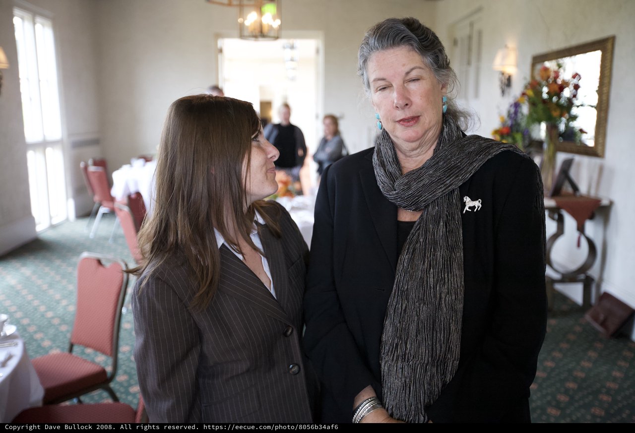 Two Women Sharing a Quiet Moment at Memorial Gathering