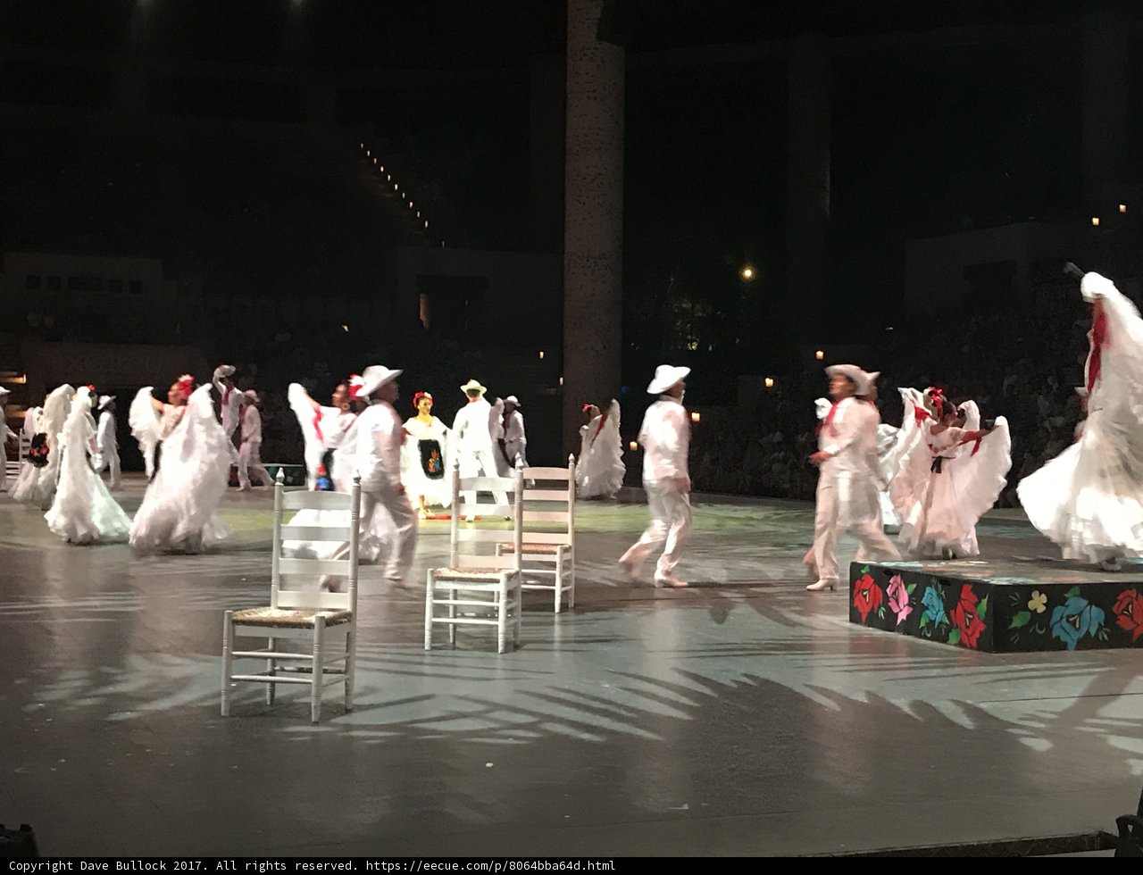 Stage Performers in White Costumes