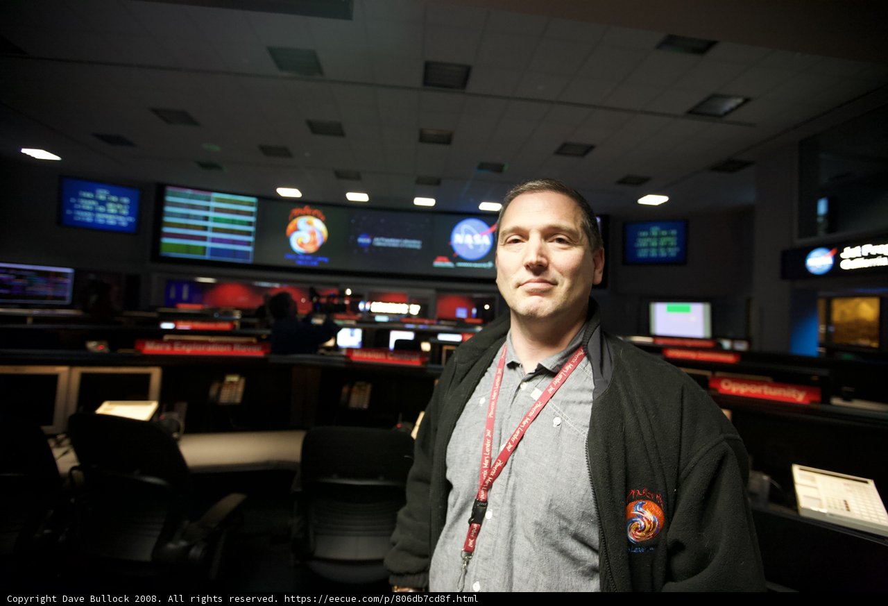Man in front of 8-screen display