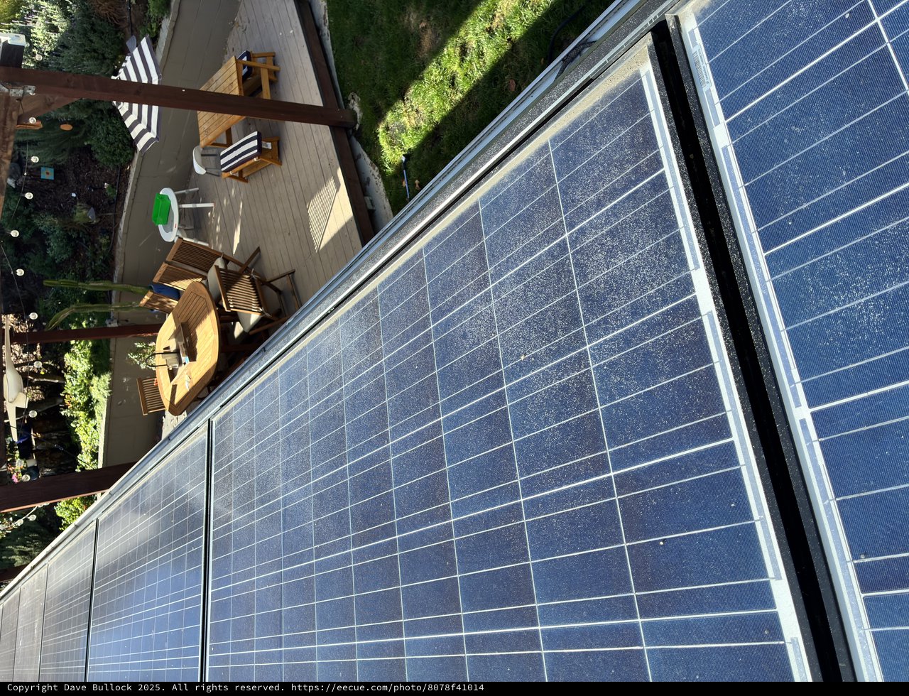 Residential Solar Panel Installation Above Backyard Deck