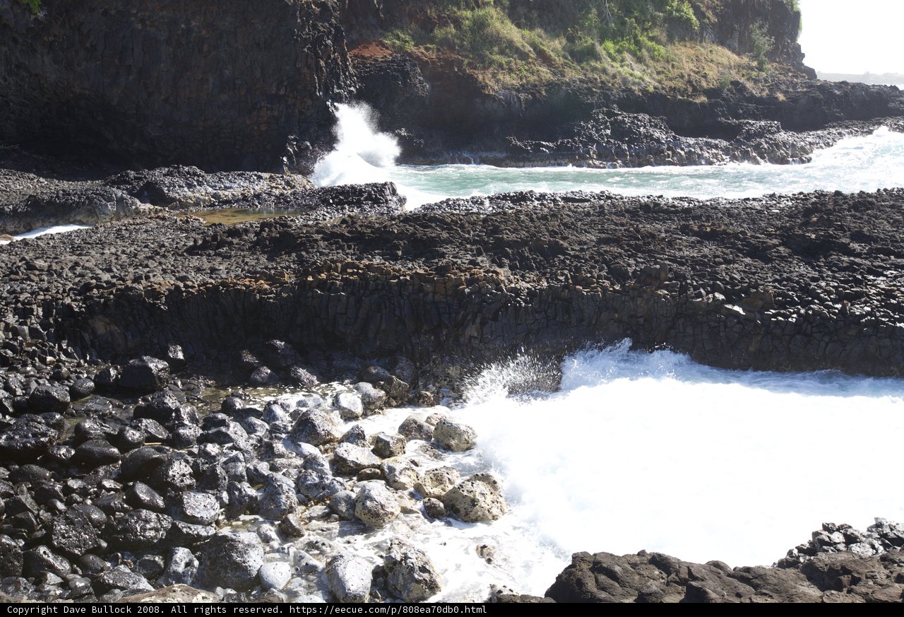 Majestic Waves Crashing Against Rocky Shore