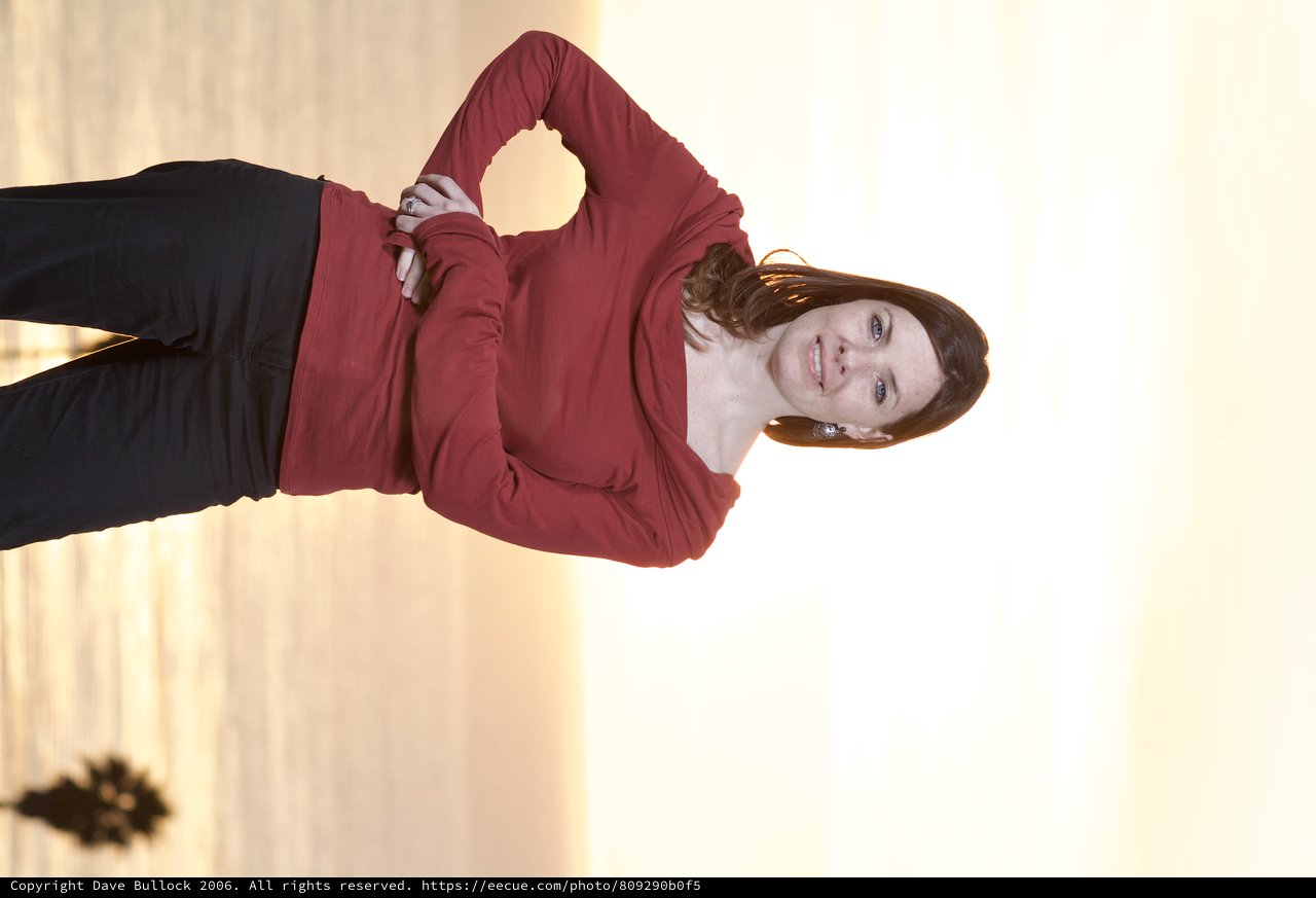 Woman Poses Confidently at Golden Hour Beachside