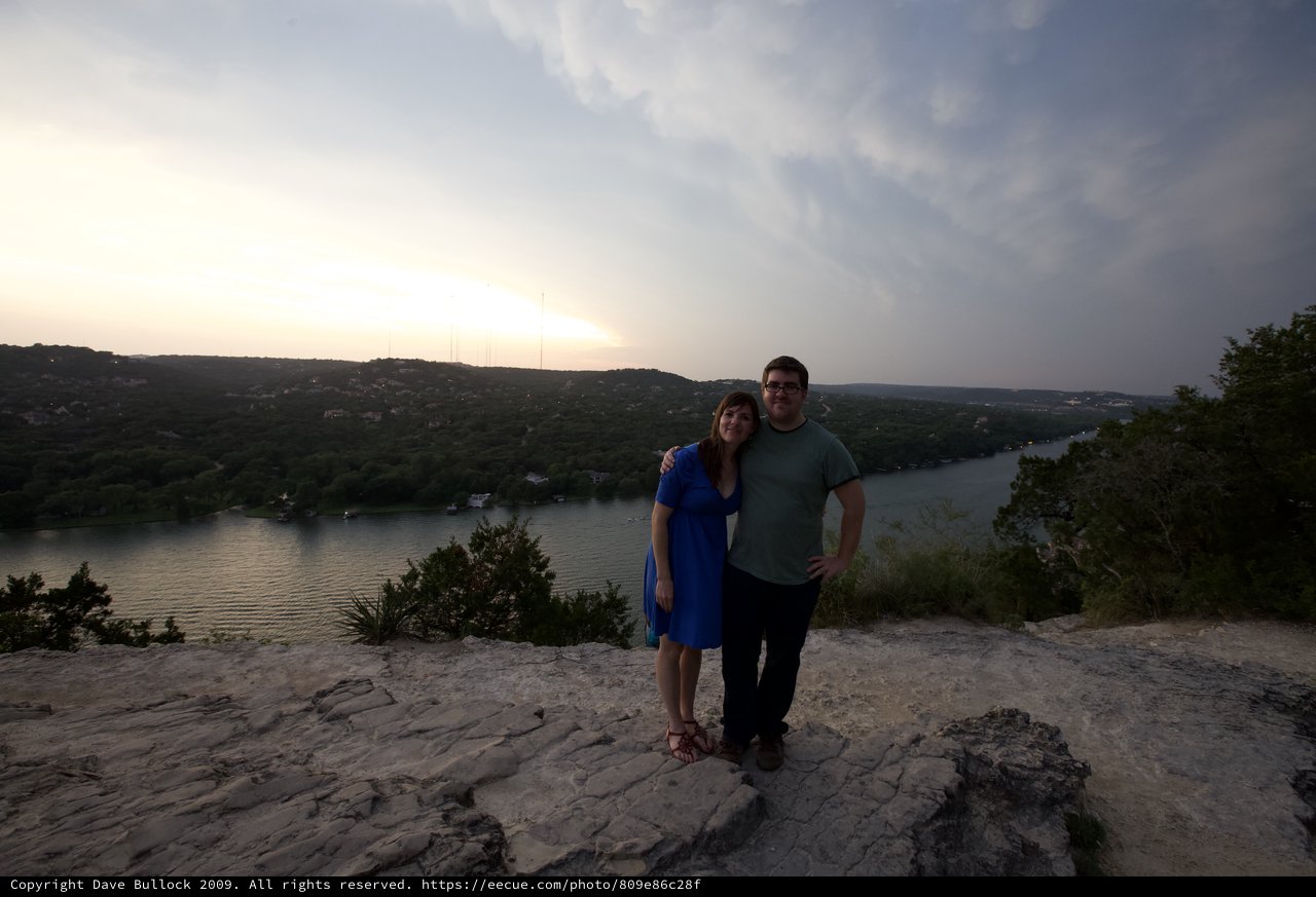 Couple Embracing at Sunset Overlook Above Lake Austin