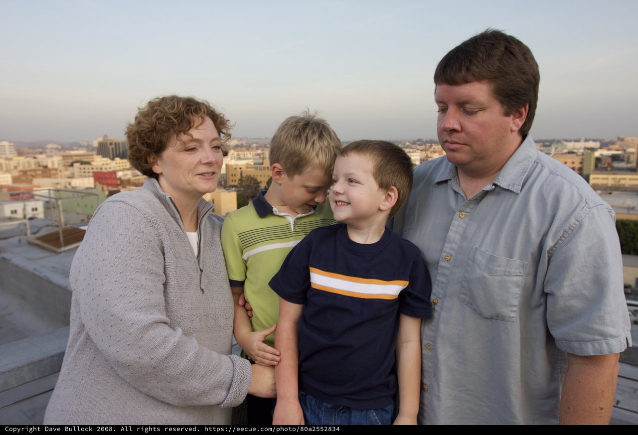 Family Portrait on Urban Rooftop at Dusk