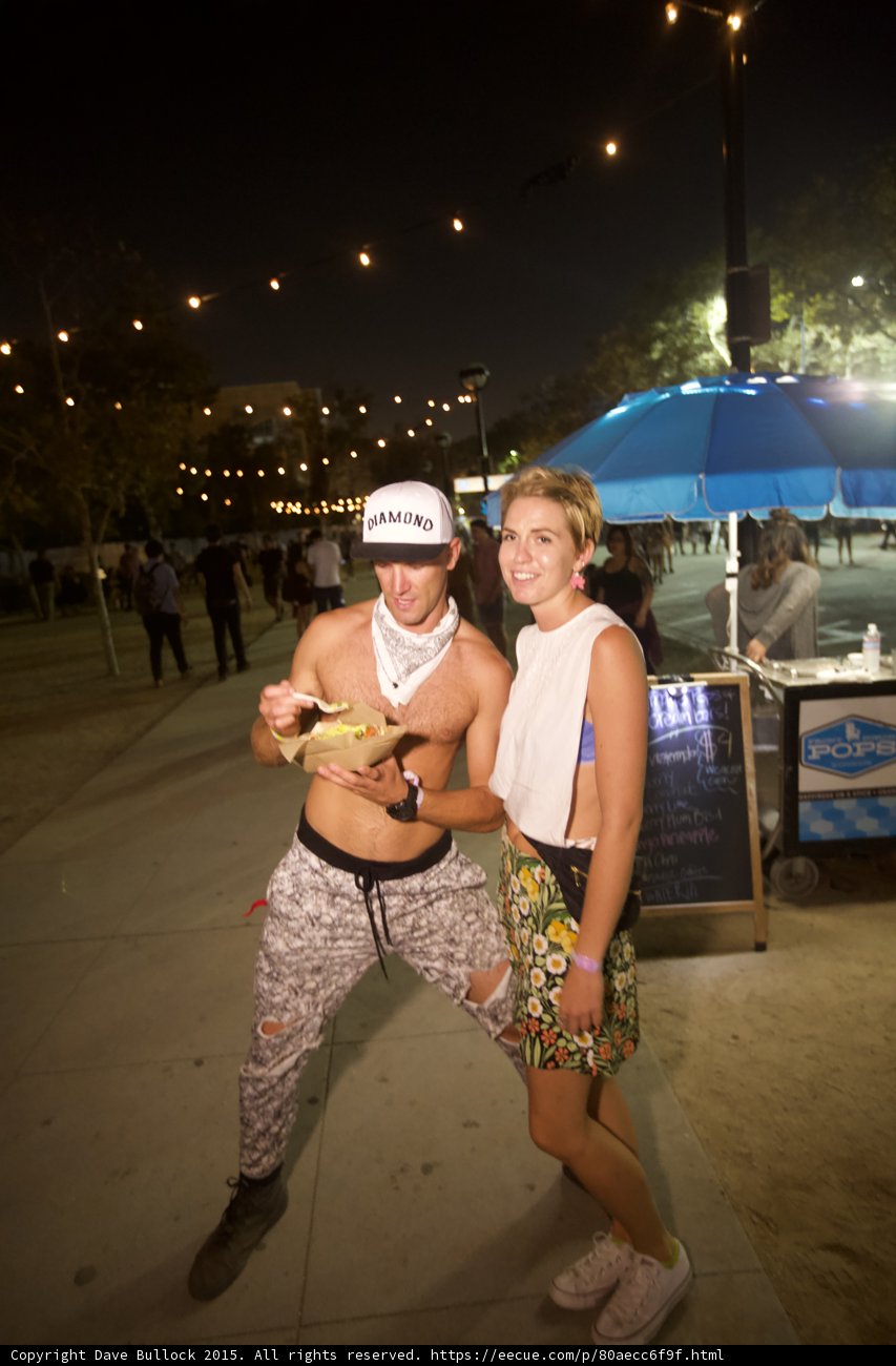 Playful Couple with Festival Food